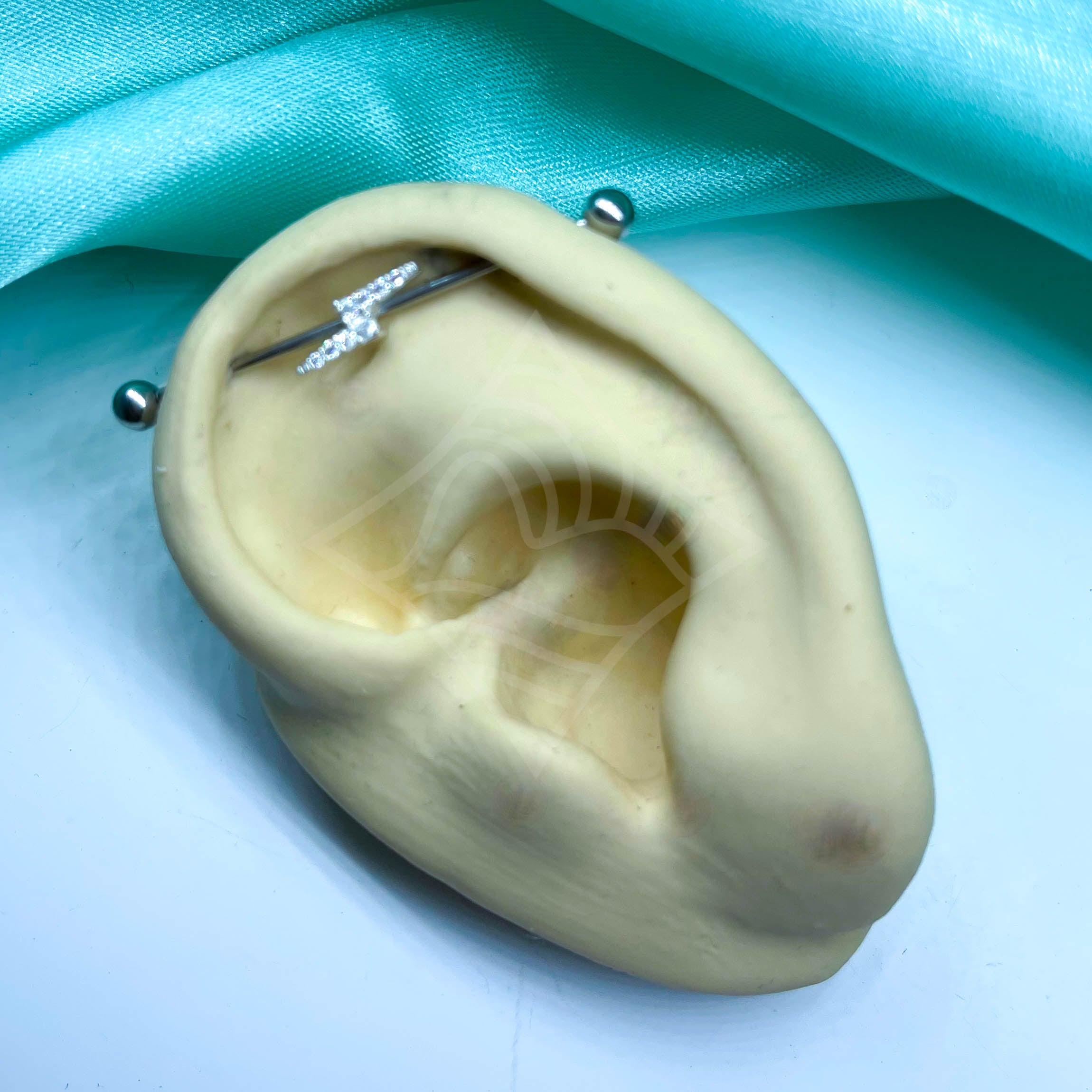 Piercing Transversal Raio Cravejado